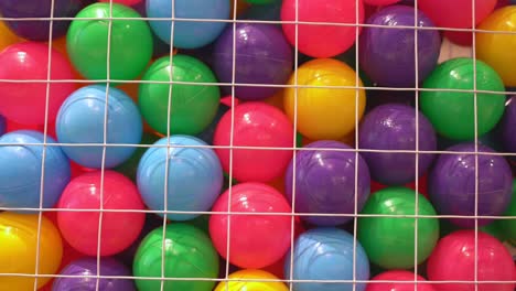 colorful balls for kids in a net