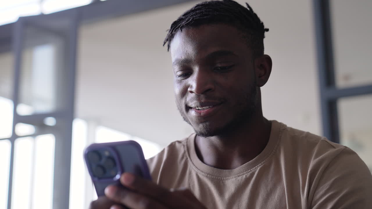 Man using phone at home