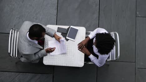 Top-view-of-confident-business-people-reaching-agreement