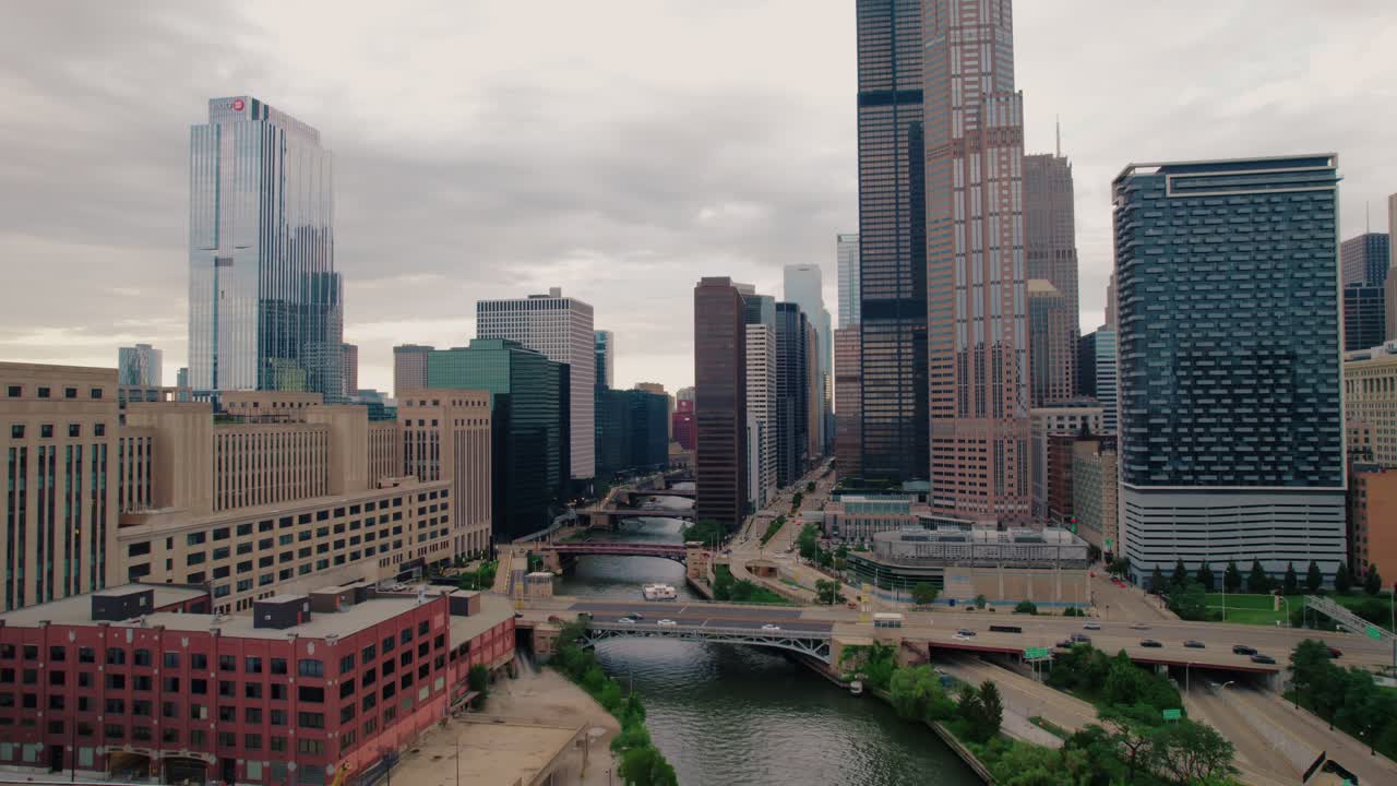 A classic daytime drone establishing shot of downtown Chicago showing the mixture of historic and modern architecture
