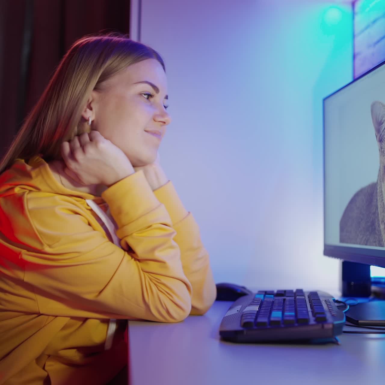 . Woman looking at computer. Portrait of teenage girl looking at monitor of computer