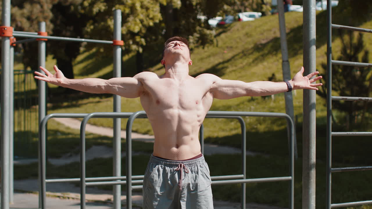 Athletic caucasian topless muscular man stretching body and warm up before cardio workout exercises