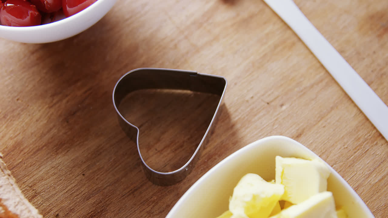 Various ingredients and kitchen appliance on wooden table 4k