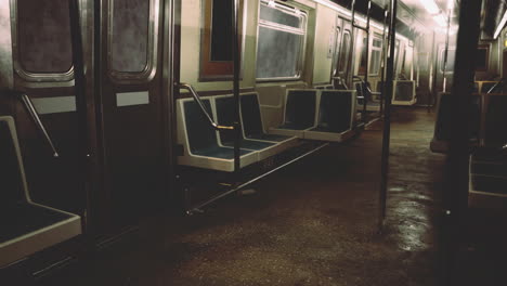 empty subway train interior with dim lighting and wet floor