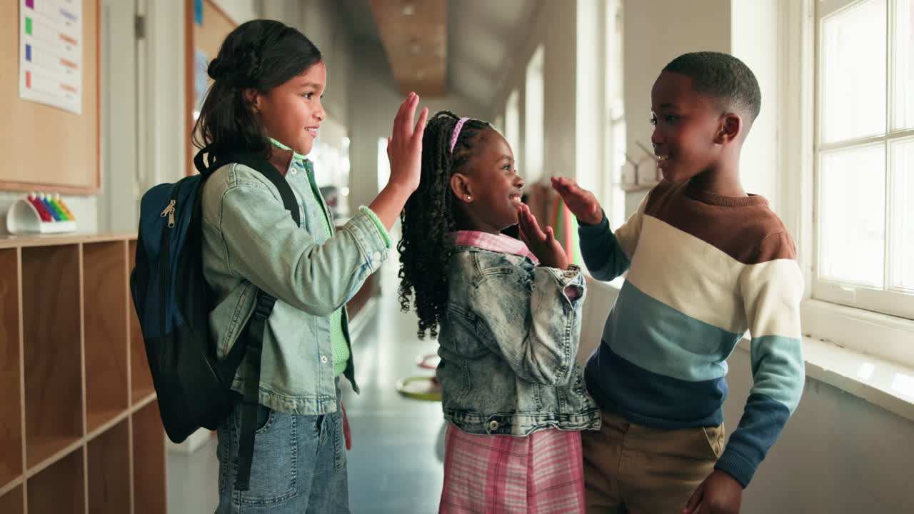 Children High-Fiving in School Hallway