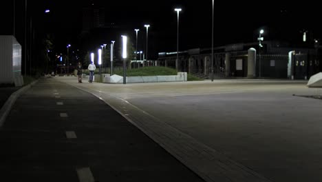 night scene of an urban pathway with people