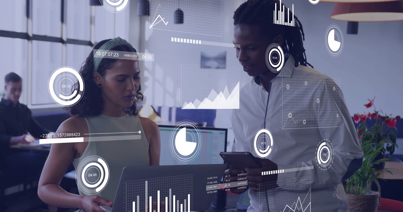 Woman glancing laptop and man tapping tablet are bringing up overlay graphs for business analysis