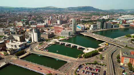 ultra-wide advancing aerial gv of belfast city centre, northern ireland, uk on a bright and sunny day. produced in 4k, 60fps and with rec709 color