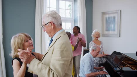 group of seniors enjoying dancing club together