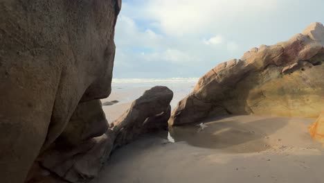 Strolling-amidst-the-rugged-stones-and-rocky-formations-along-Zahara's-Spanish-coastline,-illustrates-the-concept-of-natural-coastal-environments