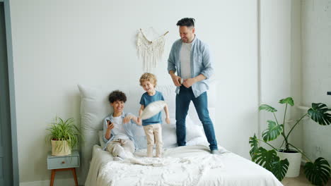 happy family having fun in bedroom