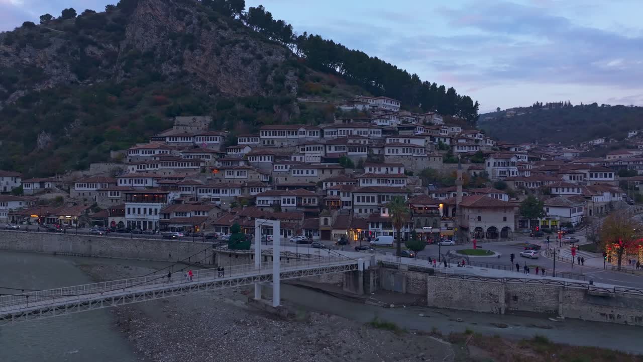 Drone shot of Osum river flowing through Berat's historic old town, Albania