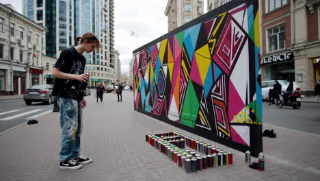 street artist painting a mural