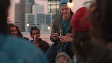 group of young friends enjoying rooftop party celebration drinking having fun chatting sharing friendship students making toast to summer vacation