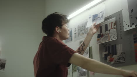 young designer working on a mood board for interior design project