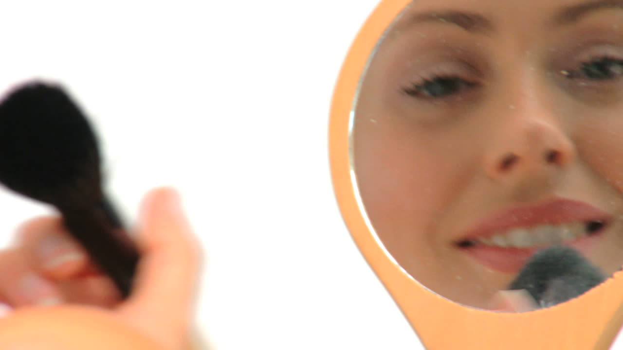 Woman putting on make up