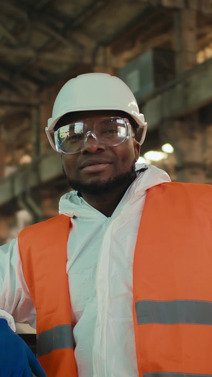Worker in Protective Gear at a Factory
