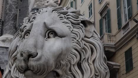 close up shot of a large stone carved lion in genoa, italy