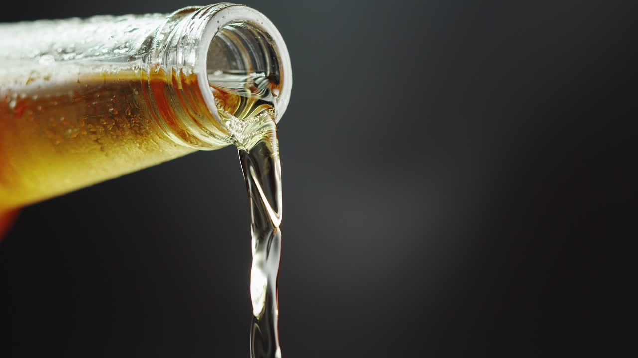Pouring Cold Beer from Bottle