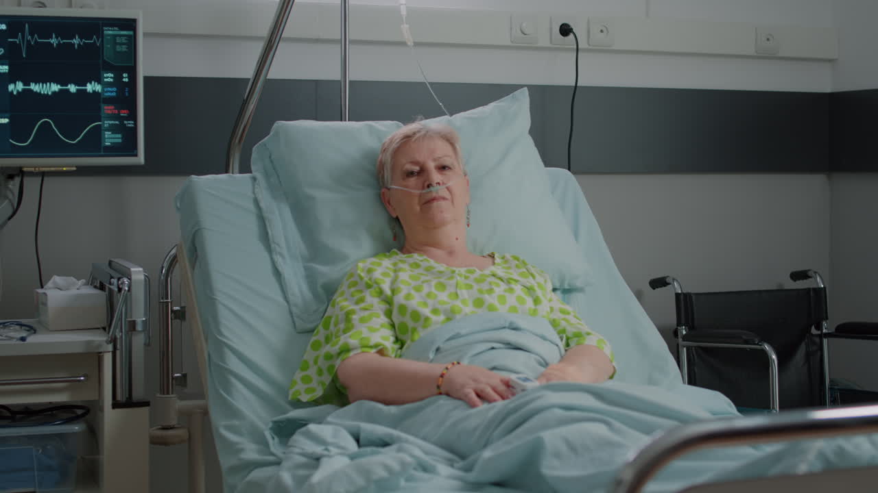 Portrait of pensioner waiting to receive medical support in hospital ward
