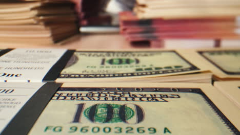 specialised police officer counting dollar banknotes in crime lab, conceptual image. high quality 4k footage