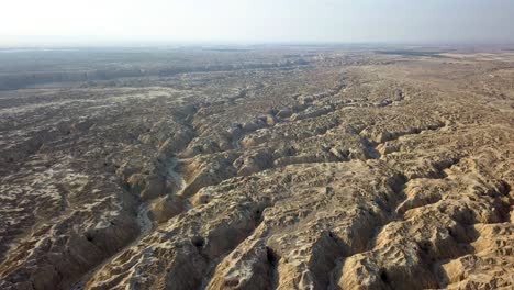 aerial view over large wadi with soft sedimentary rock, arava desert