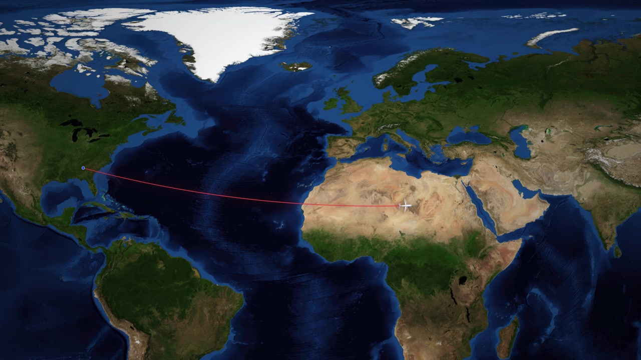 世界地図上をアトランタからドバイへ飛ぶ飛行機の軌跡を赤い線が示している。