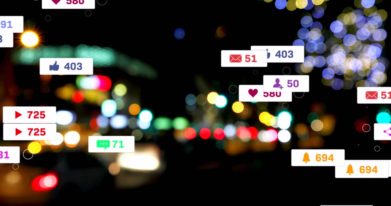 Animation of social media icons and numbers over out of focus city lights