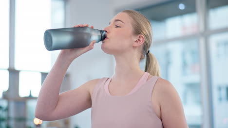 Woman,-home-and-drink-of-water-for-sports-break