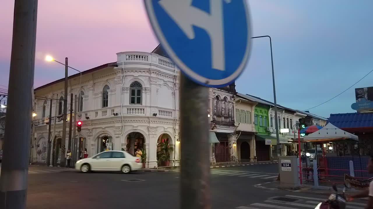 Hyperlapse landscape architecture view of the ancient local street with beautiful shino-portuguese architecture town house building in Phuket old town in evening sunset time