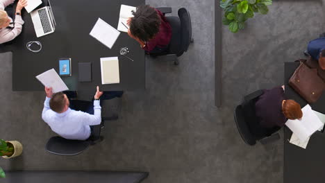 overhead view of people working in an office