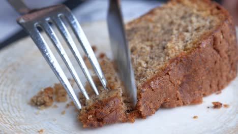 person cutting a slice of cake