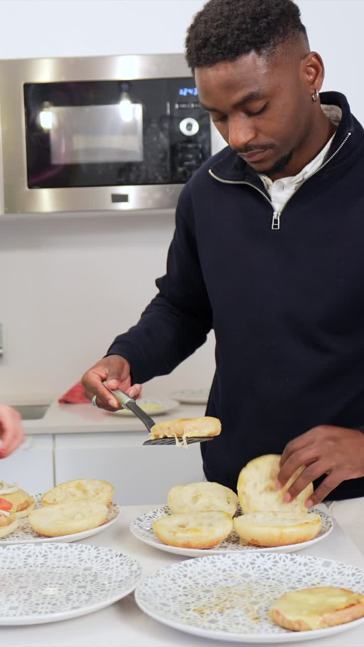 Man cooking sandwiches in the kitchen