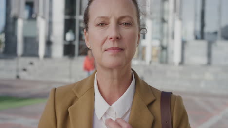 portrait-confident-middle-aged-business-woman-preparing-for-corporate-meeting-wearing-stylish-suit-in-city-slow-motion