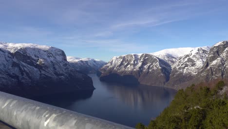 magnificent panoramic view over aurlandsfjord in sognefjorden norway - railing of stegastein vewpoint in foreground