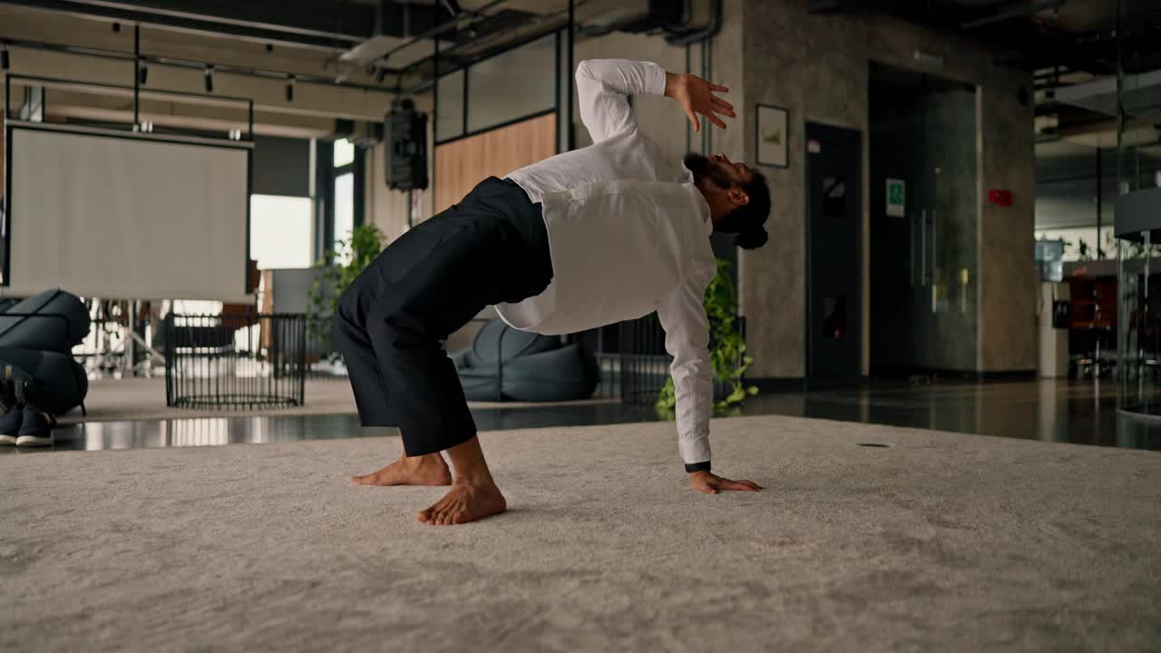 Businessman Doing Yoga in Office