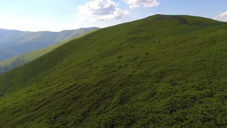 aerial flight over green hill mountains. fpv dynamic drone shot