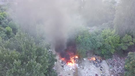 fire spreading through the surrounding garbage