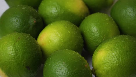 lime green lemon citrus fruit fresh crips water splash drops up close rotating