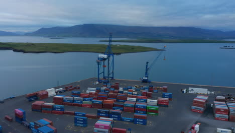 Birds-eye-of-Sundahofn-harbour-in-the-east-side-of-Reykjavik,-Iceland-capital-city,-with-lot-of-container-ready-to-be-shipped.-This-harbor-is-the-largest-cargo-port-in-the-country.-Import-and-export