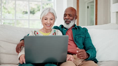 Old-couple-on-sofa-with-laptop