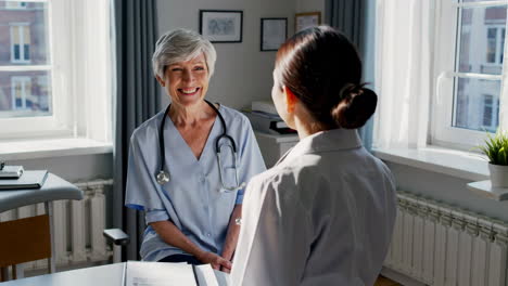 medical consultation between doctor and patient in a clinic