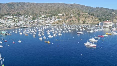 Flying-over-yachts-and-boats-blue-ocean-and-tropical-beaches-at-Aerial-view-of-Catalina-Island