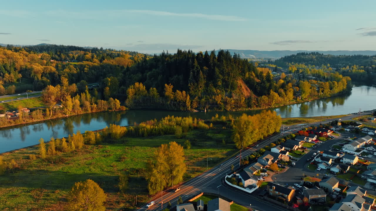 Cozy countryside neighborhood with lovely cottages. Picturesque nature with river at backdrop. Top view.