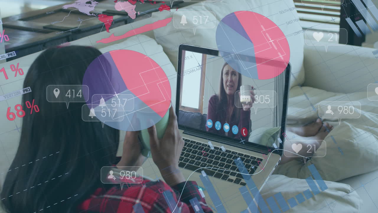 animación de iconos de las redes sociales contra una mujer biracial haciendo una llamada de video en una computadora portátil en casa