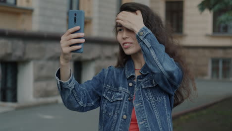 young woman taking selfie in the city