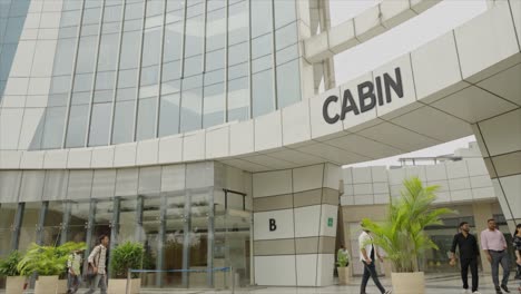 people entering the cabin building