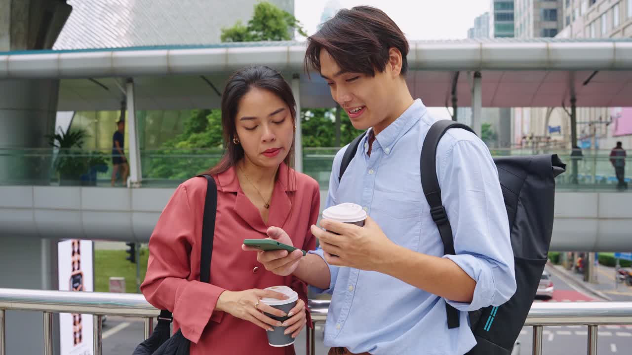 People looking at smartphone in the city