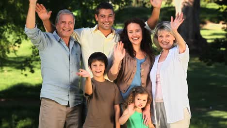 Family-waving-at-the-camera