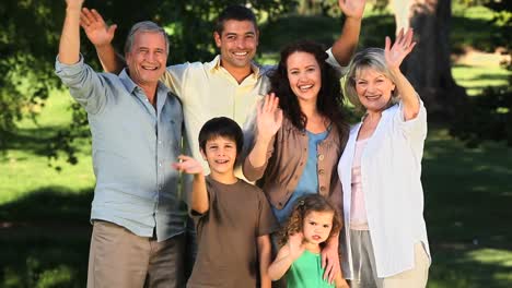 family waving at the camera